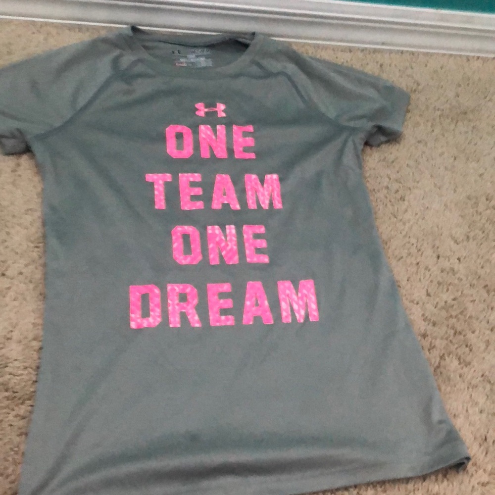 A hot pink and grey Under Armour shirt.